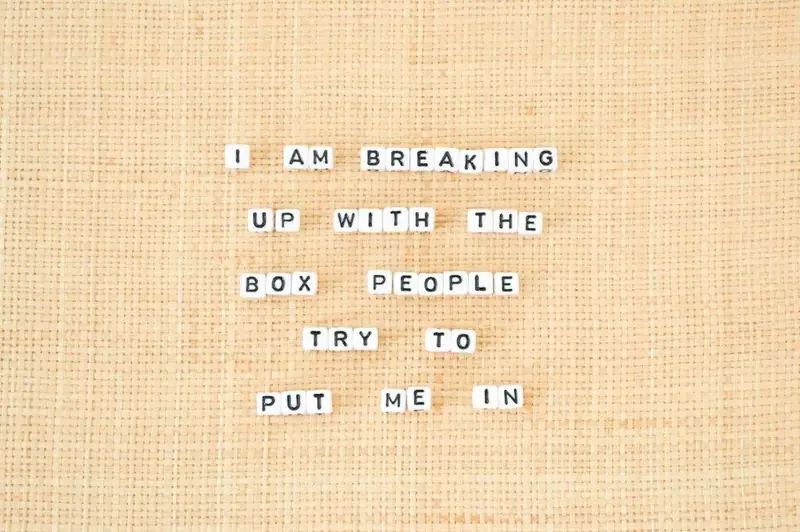 Letter tiles reading “I am breaking up with the box people try to put me in”