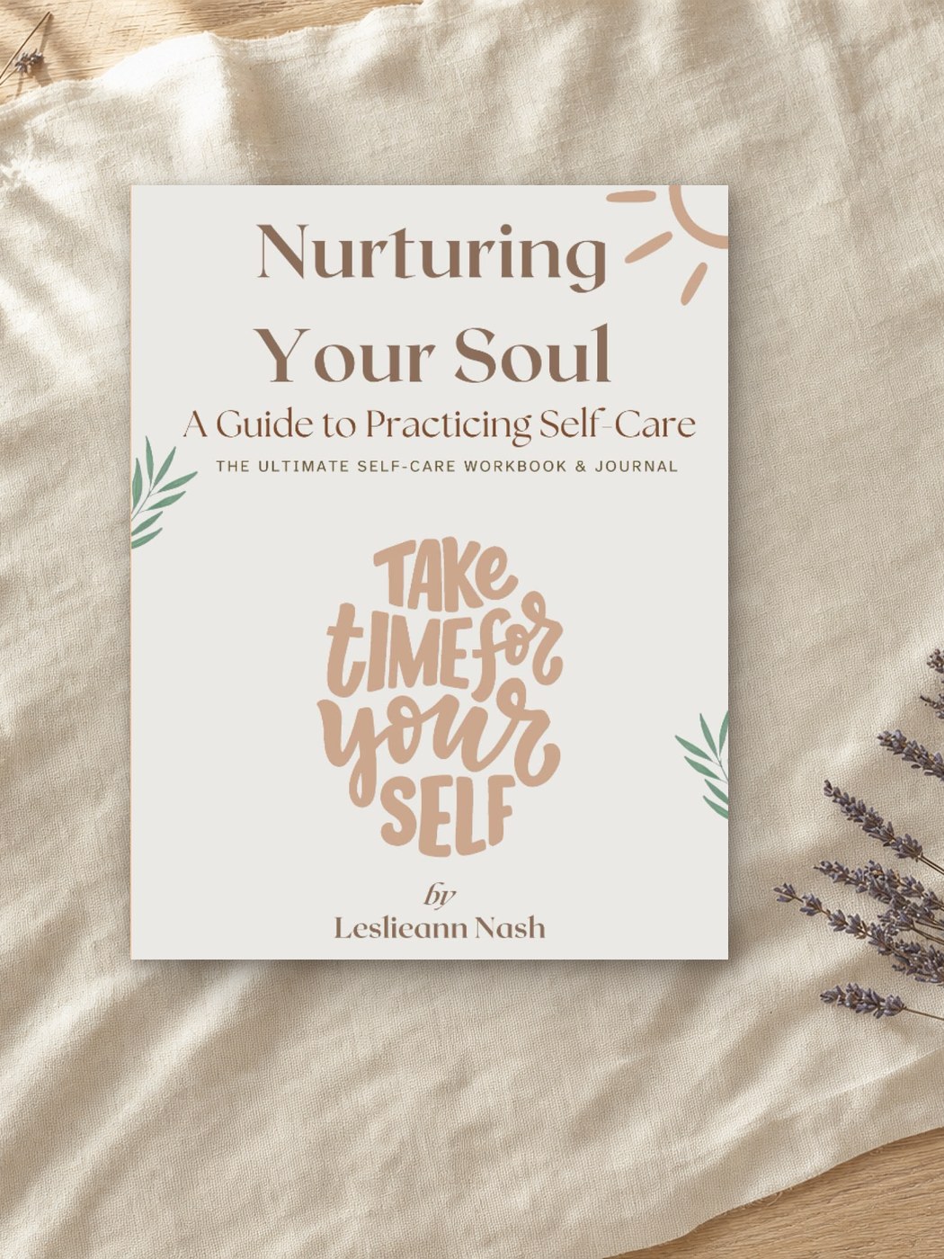 A sage green hardcover journal on a wooden table beside a cup of tea