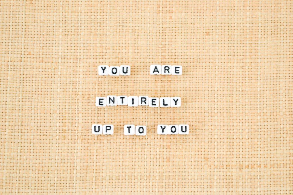 Letter tiles reading “You are entirely up to you”