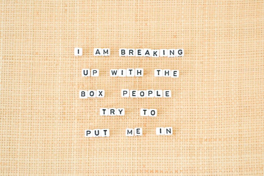 Letter tiles reading “I am breaking up with the box people try to put me in”