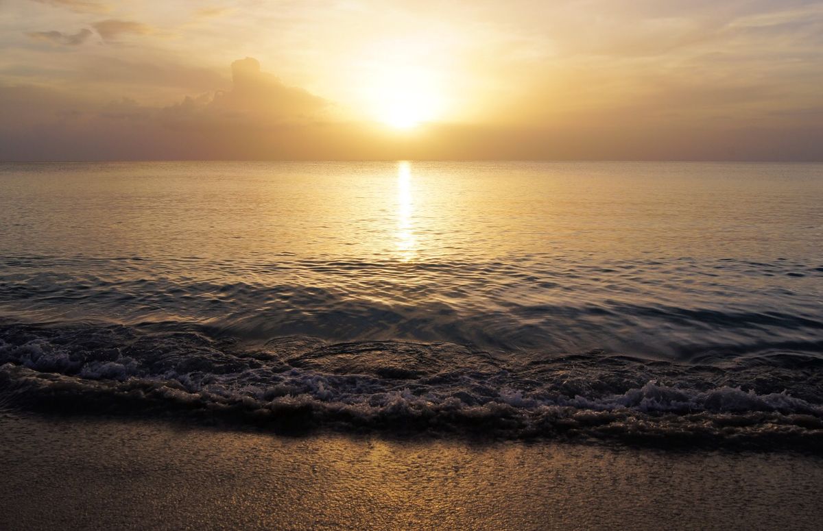 Sunset reflecting across ocean waves