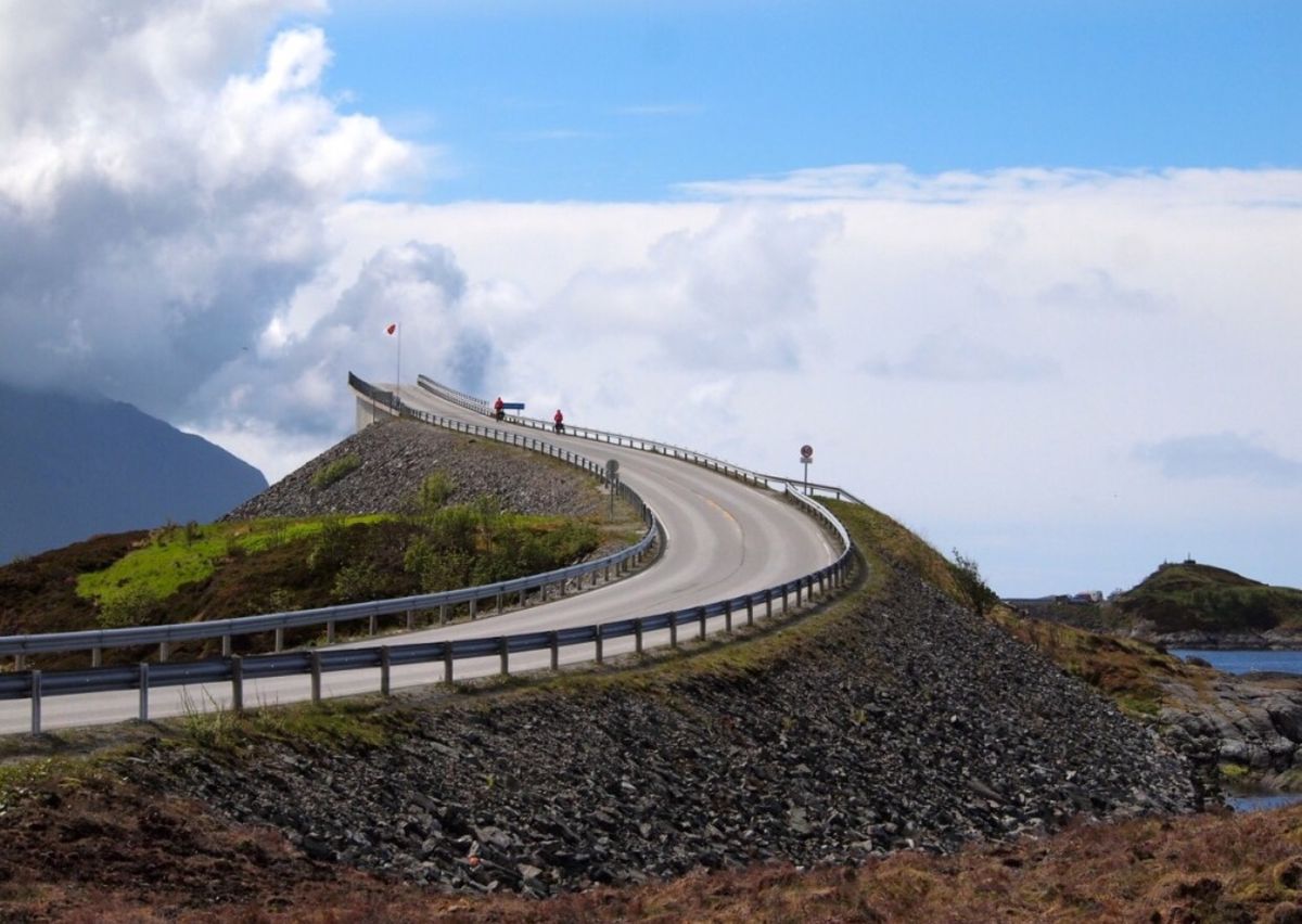 Winding coastal road climbing a rocky hill